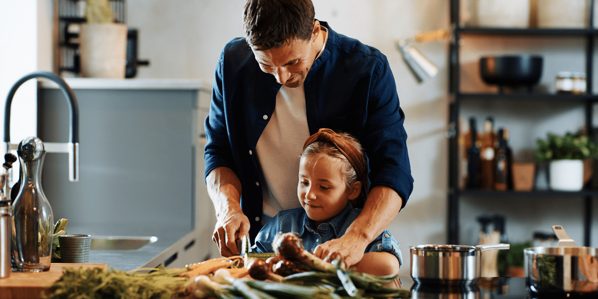Father and daughter preparing meal