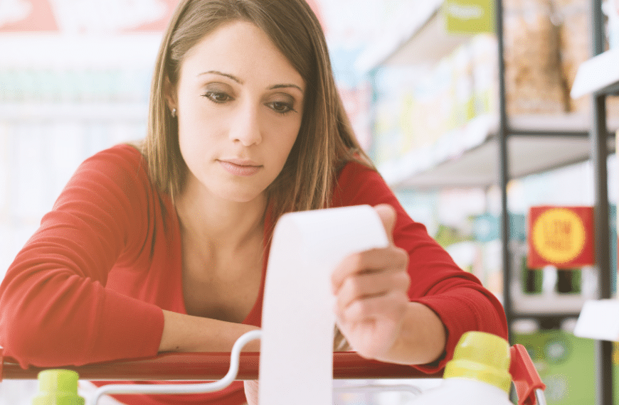 Shopper looking at grocery reciept