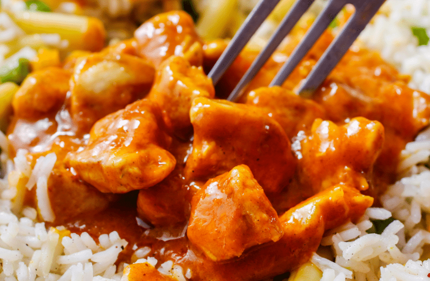 orange chicken on a bed of rice